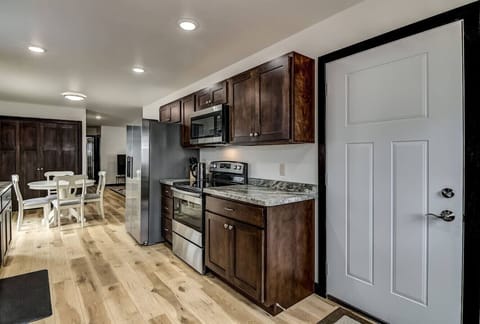 Kitchen with dishwasher and brand new appliances.