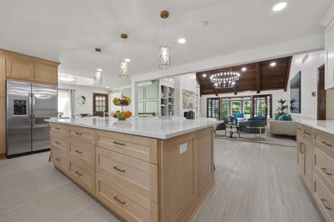 Massive quartz island and open-concept layout — perfect for gathering, prepping, and entertaining in style.