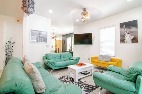 Cozy living room with vibrant green sofa