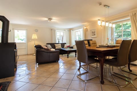 Cozy Living Room with Sofa and Dining Table