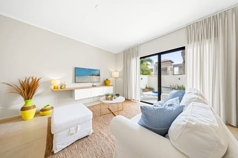 Open living space with natural light, stylish decor, and patio doors.