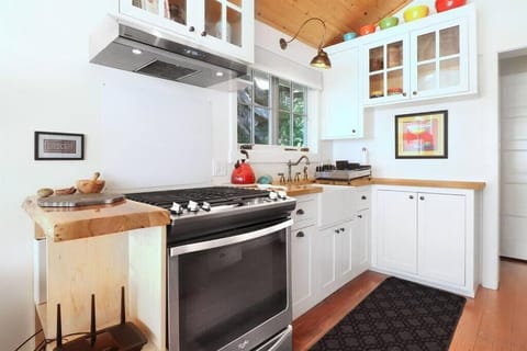 A chef's kitchen with high-quality appliances and fixtures.