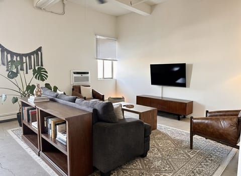 Spacious living room with city skyline views