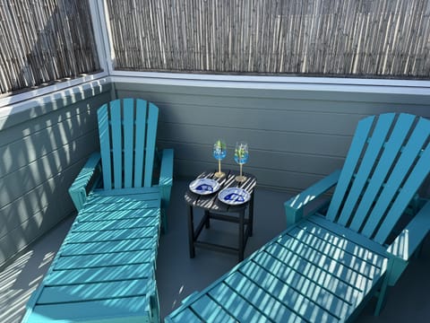 Private balcony off the main bedroom offers the perfect spot to relax with a drink or a good book.