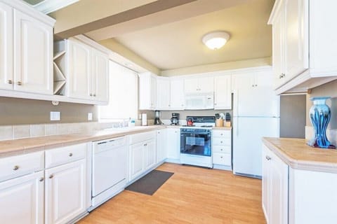 Upper unit kitchen. Dishwasher, microwave, blender, crockpot,12 cup coffee maker and cook/dinnerware