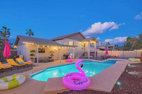 Poolside Bliss - Kick back on plush sunbeds under twinkling lights