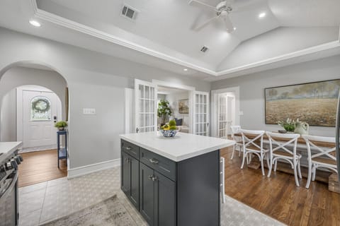 Vaulted ceilings in the kitchen and dining room make this property truly unique