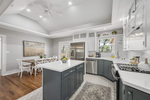 Beautiful open concept kitchen with island and adjacent dining room.