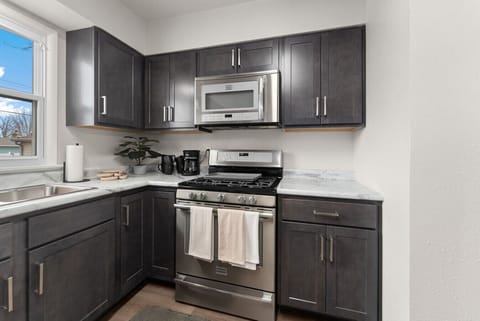 Enjoy the convenience of a fully stocked space with cookware, utensils, coffee maker, mugs, and essential supplies