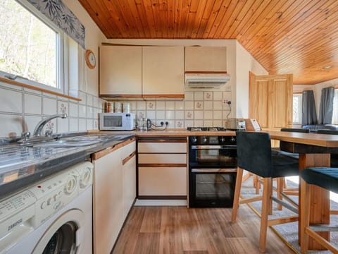 Interior Design, Flooring, Kitchen, Floor, Wood, Furniture, Ceiling, Countertop, Major Appliance, Cabinetry