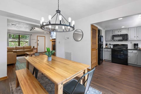 Gather around the stylish table for meals and memories in this open-concept space!
