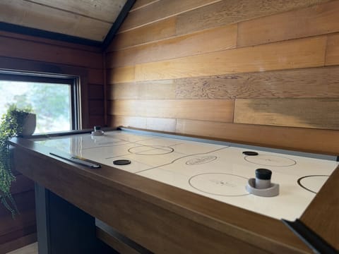 Challenge your friends to a game of air hockey.