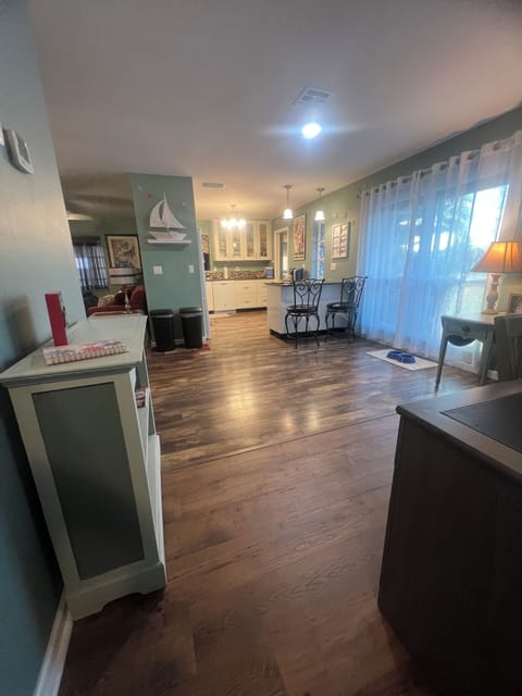 View from hallway near bedrooms looking at kitchen area