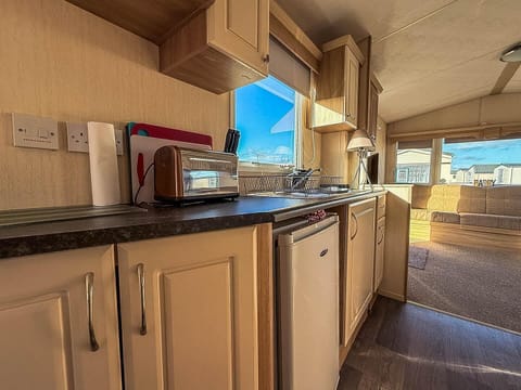 Bright, airy kitchen with scenic window views and modern amenities