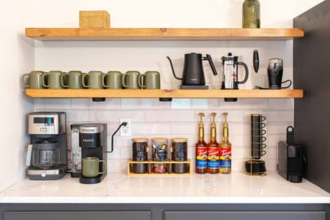 Coffee & Tea Main Bar is complete with beans, teas, Nespresso espressos, K-Cups, creamer, sugars, kettle, French press, coffee pot & grinder. Add in the specialty flavorings and you wont need to drive to get your morning fix, unless you want to, of course!