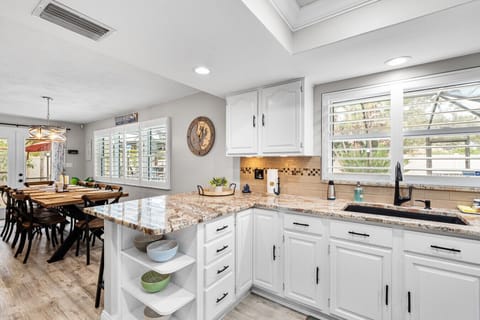 The property boasts a spacious, fully equipped kitchen complete with modern appliances and ample counter space for a perfect preparing gourmet meals.