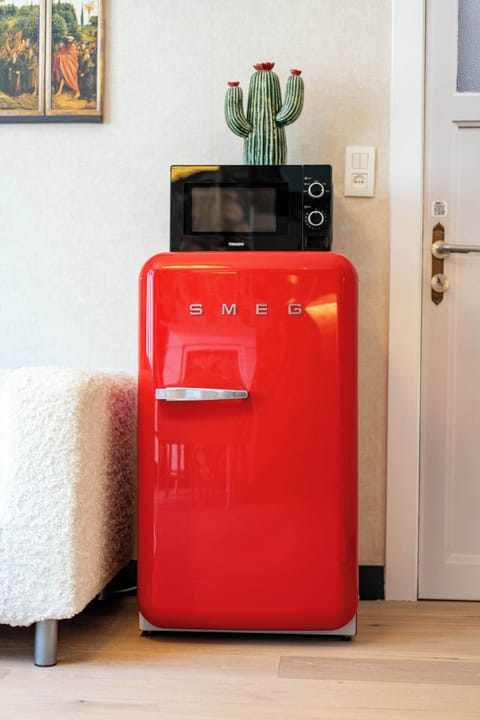Iconic red fridge — bold, stylish, and practical.