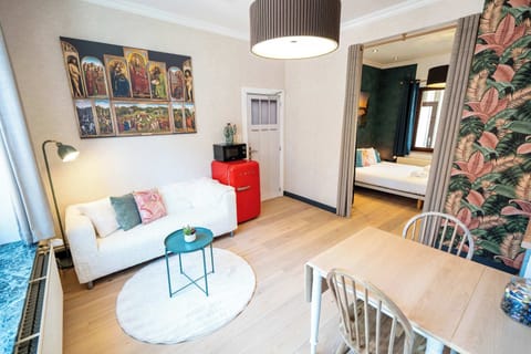 Bright living room with colorful art and natural light.