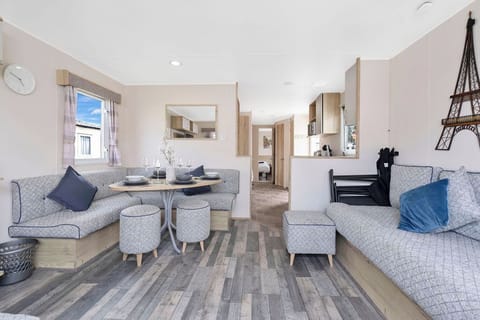 Modern, airy holiday unit with spacious seating, stylish dining, and a well-equipped kitchen—ideal for a relaxing stay.