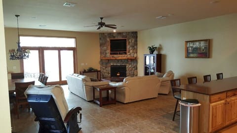 Entertainment lounge, dining table, massage chair, and kitchen counter seating