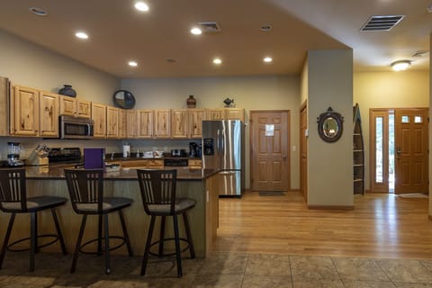 The Town Home kitchen with view of garage and side entrance doors