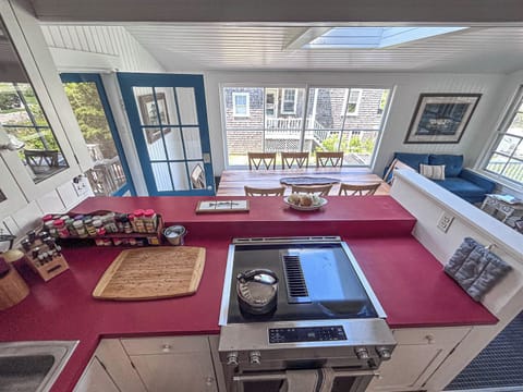 Fully equipped kitchen with dining table and seating area. 