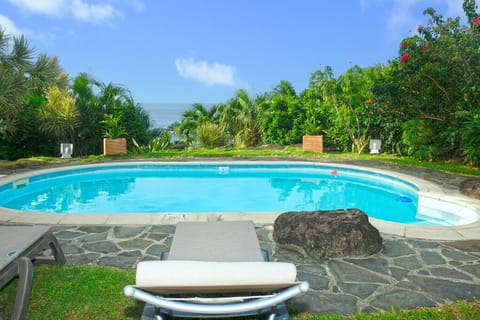 Villa Bwa Cacao for a dream vacation. Nestled in a lush garden with the stunning Caribbean Sea on the horizon for unforgettable sunsets.