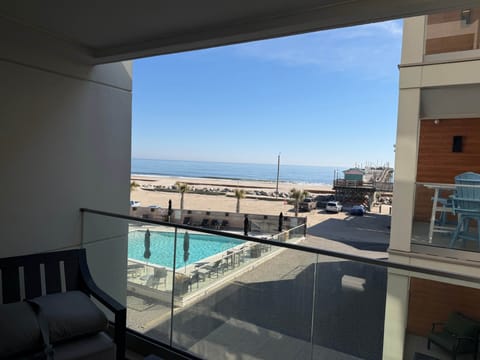 Ocean views, resort-style pool, beach access, and pier just steps away