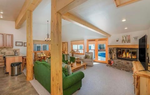 Cozy and inviting living room with fireplace and mountain views