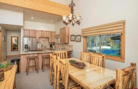 Spacious dining for family and friends — seating for 6 at the table, plus 4 more at the kitchen counter for casual gatherings