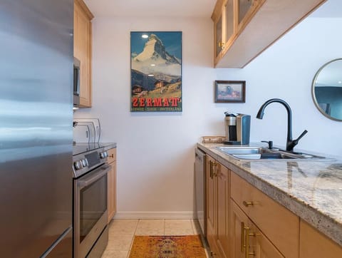 Fully stocked kitchen with oven, dishwasher, and Keurig