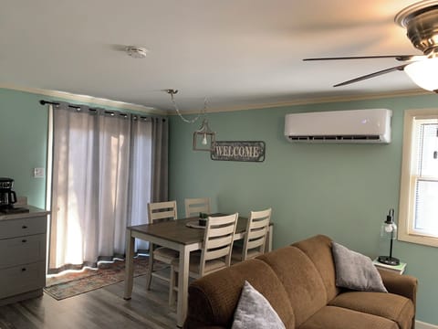 LIVING ROOM: Living room with dining area in the background