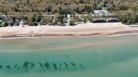 OVERALL:  An aerial view of the property, the private beach, and Lake Huron