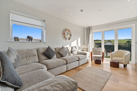 Living room with sofa and Tv at  7 Porthilly View in Padstow