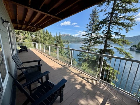 Lower Deck with Adirondack chairs and tables! Look at that VIEW