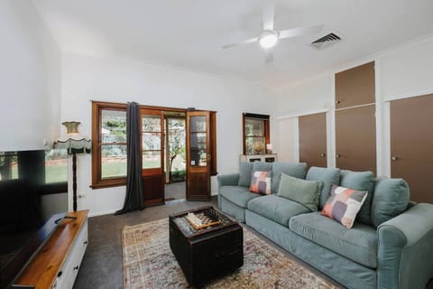 Retreat to the second living room, where a comfortable sofa, garden view, and TV set the scene for movie nights, board games, or simply relaxing after a day of wine tasting.