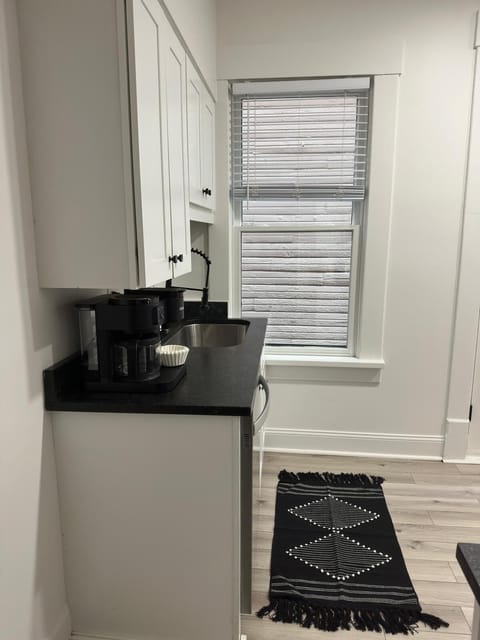 Elevate your culinary experience at Jungle House Airbnb with our sleek and modern kitchen, complete with stainless steel appliances and elegant finishes  Your gourmet retreat in Short North Columbus