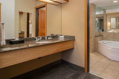 Refresh at the expansive vanity, then soak in comfort.