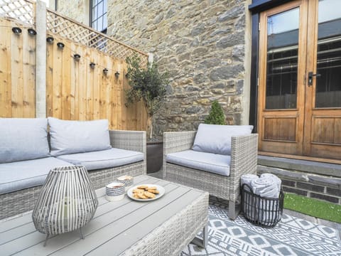 Garden sofa, chair and table in the outside area.
