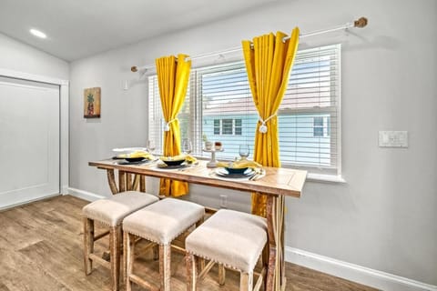 Dining Nook: Bright yellow curtains frame your meals with style in this inviting space!

