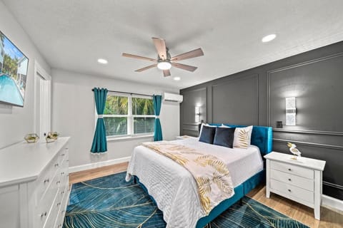 Bedroom Retreat: Relax in style with vibrant decor and serene pool views just outside your window!