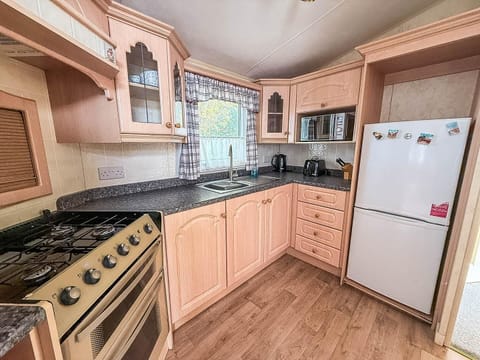 Cozy kitchen with ample storage and natural light