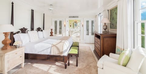 Unwind in a spacious bedroom with airy coastal elegance.