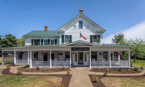 Historic inn with a spacious wraparound porch and garden seating