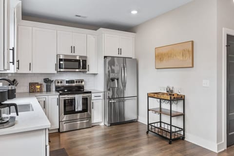 Enjoy the bright, spacious and fully-equipped kitchen for all your cooking needs. Stainless steel appliances, coffee maker, and all the utensils you might need are provided.