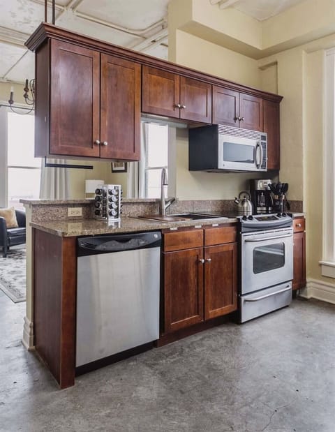 Fully equipped kitchen with stainless steel appliances.