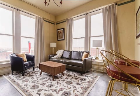 Modern, inviting living space with skyline views.