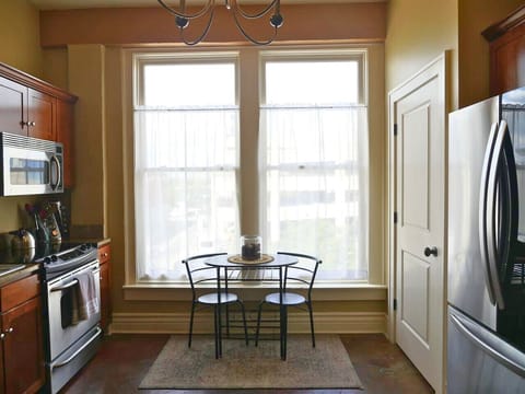 Charming breakfast nook with natural light and city views — perfect for morning coffee or an intimate meal.