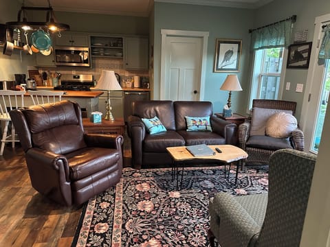 Living area with comfy leather sofa and recliner