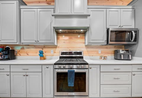 A closer look at the kitchen shows off the beautiful cabinetry, modern finishes, and everything you need to feel right at home.